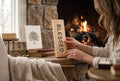 Keepsake lane wooden block sign with BLESSED text, held by a woman near a cozy fireplace mantel.
