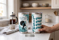 Keepsake lane personalized stainless steel tumblers featuring floral artwork, scripture, and custom name on a counter